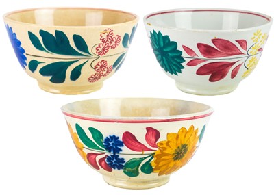 Lot 1174 - Three 19th century Staffordshire pottery graduating spongeware bowls.