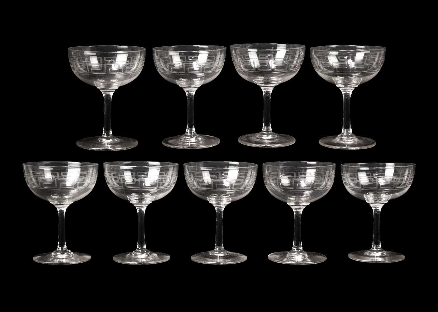 Lot 389 - A set of nine Edwardian glass champagne tazzae.