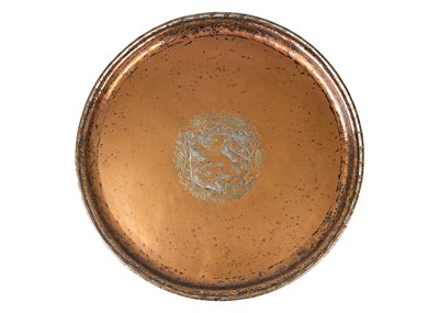 Lot 122 - An Arts and Crafts copper charger by Hugh Wallis.