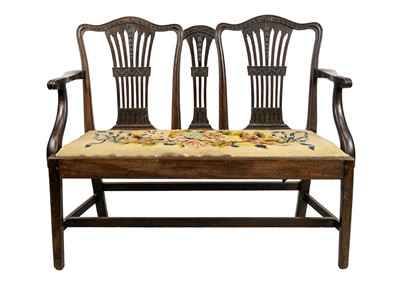 Lot 623 - A 19th century mahogany double chairback settee.