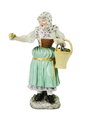 Lot 410 - A late 19th century Meissen porcelain figure of an apple seller.