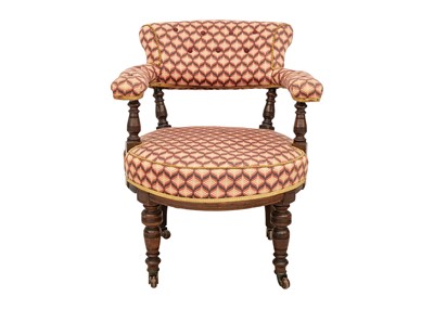 Lot 577 - A Victorian walnut upholstered tub chair.