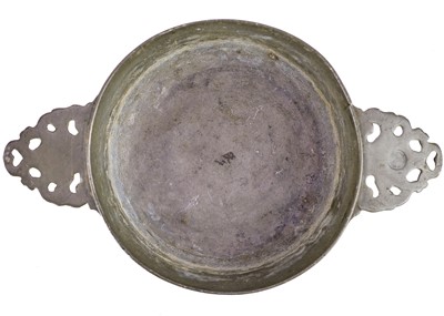 Lot 1052 - A pewter porringer.