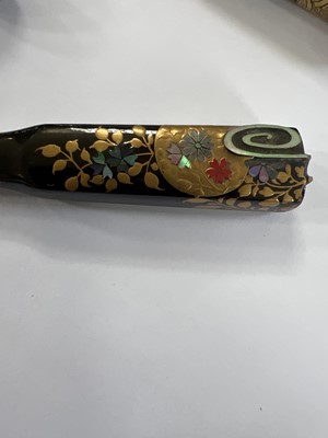Lot 495 - Twenty Japanese black and mainly gilt laquer kogai, 19th/20th century.