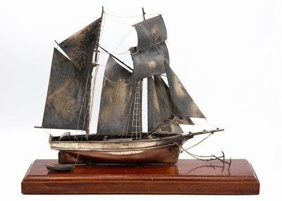 Lot 130 - A good modern hallmarked silver model of a Topsail Schooner in a glass display case.