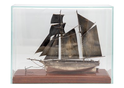 Lot 115 - A good modern hallmarked silver model of a Topsail Schooner in a glass display case.