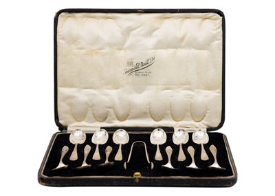 Lot 119 - A George V silver cased set of twelve teaspoons and sugar tongs by Cooper Brothers & Sons Ltd.