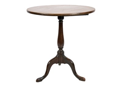 Lot 596 - An early 19th century mahogany circular tilt top tripod table.