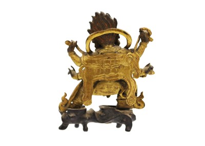 Lot 81 - A Sino-Tibetan gilt bronze figure of Mahakala, 18th/19th century.