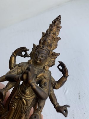 Lot 82 - A Sino-Tibetan gilt bronze figure of Avalokitesvara, 18th/19th century.