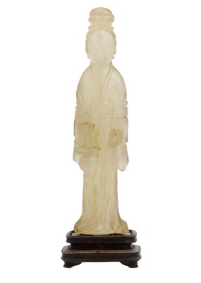 Lot 83 - A Chinese jade figure of a female immortal, Qing Dynasty, 19th century.