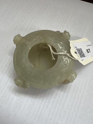 Lot 87 - A Chinese celadon jade 'four boys' water pot, Qing Dynasty.
