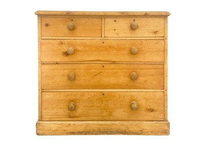 Lot 614 - A pine chest of two short and three long drawers.