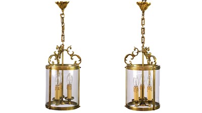 Lot 92 - A pair of circular glazed brass hall lanterns.