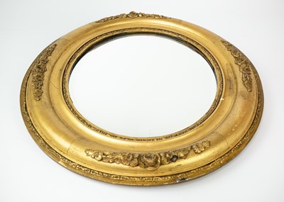 Lot 60 - An Edwardian small oval gilt gesso wall mirror.