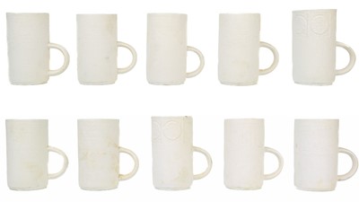 Lot 49 - A set of eight Troika biscuit pottery coffee mugs.