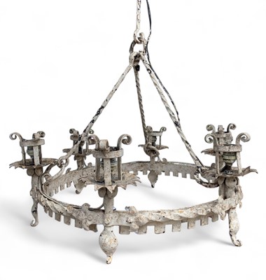 Lot 1604 - A white painted gothic style wrought iron chandelier.