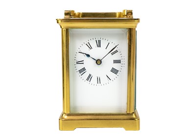 Lot 569 - A French brass cased carriage timepiece.