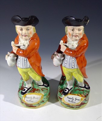 Lot 884 - Two 19th century Staffordshire Toby Jugs, each...