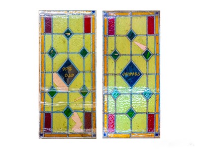 Lot 1207 - Pair of harlequin stained glass panels.