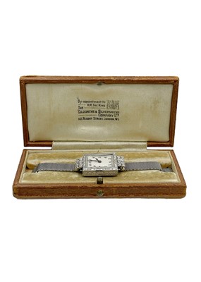 Lot 119 - GOLDSMITH'S & SILVERSMITH'S COMPANY - An Art Deco 18ct white gold and diamond set cocktail bracelet watch.