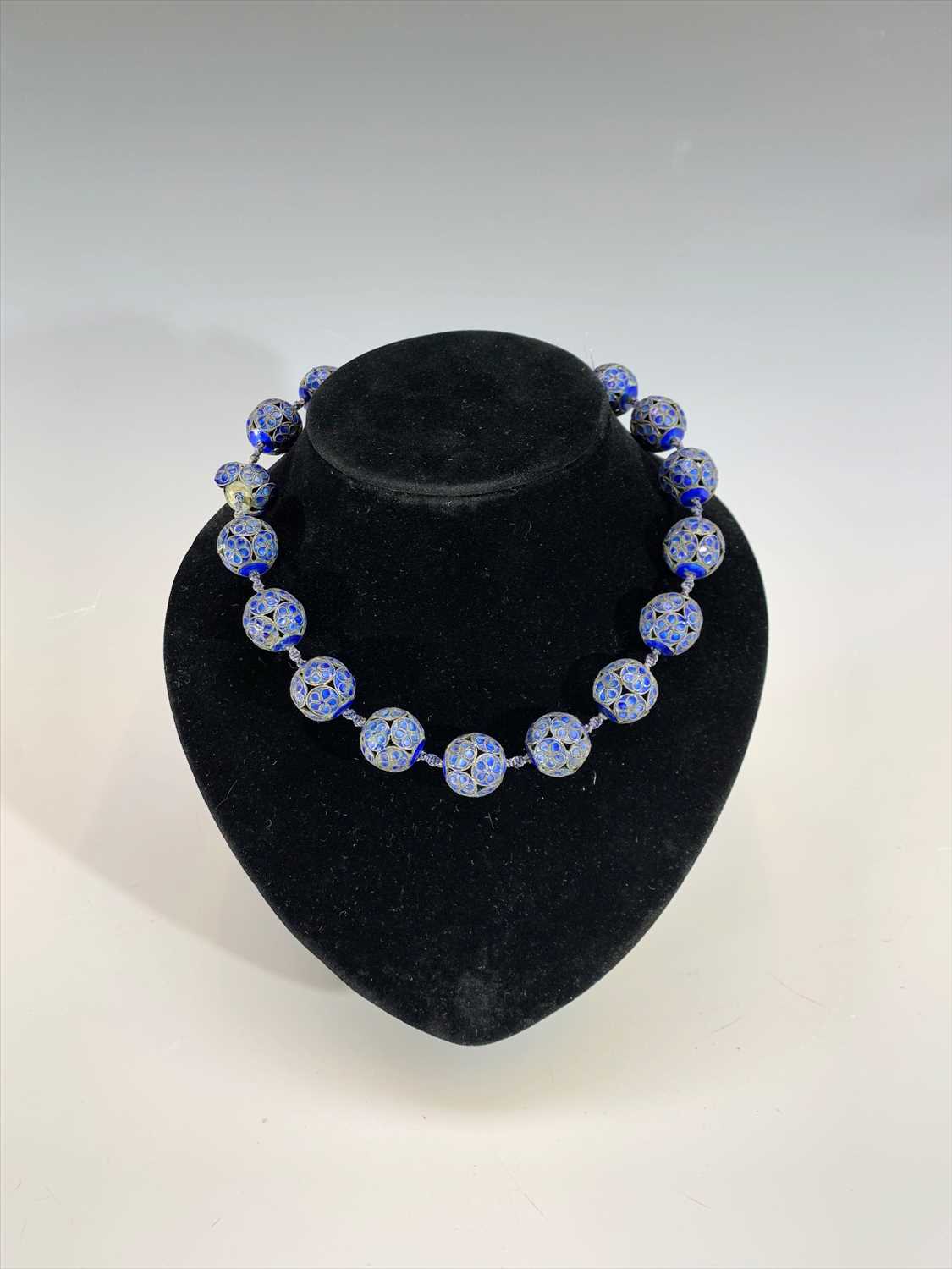 Lot 704 - A Chinese cloisonne necklace, blue enamel to...