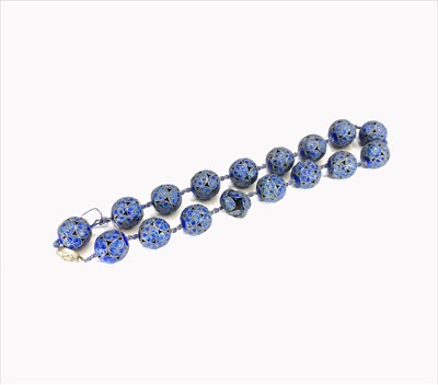 Lot 704 - A Chinese cloisonne necklace, blue enamel to...