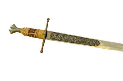 Lot 246 - A reproduction sword, with a wavy blade.