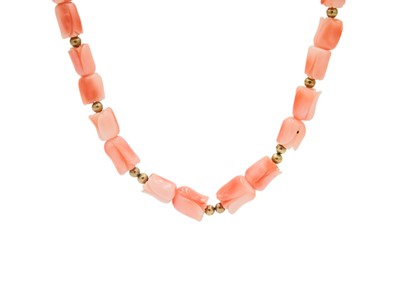Lot 40 - A carved coral bead necklace with gold ball spacers and 9ct clasp.