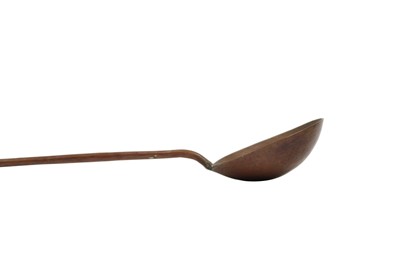 Lot 114 - A Middle Eastern copper ladle, early 20th century.