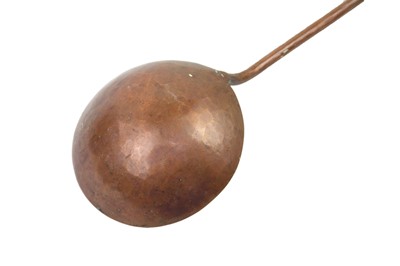 Lot 114 - A Middle Eastern copper ladle, early 20th century.