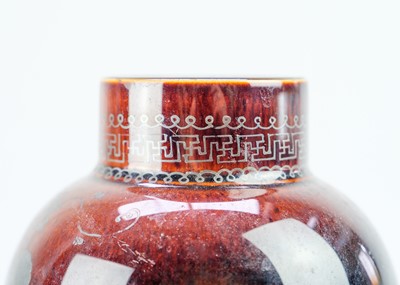 Lot 1100 - A French green glazed walnut oil jar.