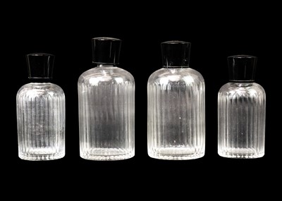 Lot 433 - A pair of Art Deco cut glass scent bottles and stoppers.