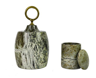 Lot 73 - A Cornish serpentine door stop with brass loop handle.