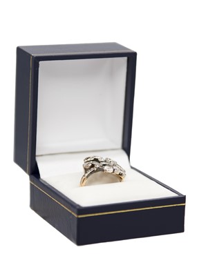 Lot 130 - An attractive late 19th-century continental diamond set foliate spray design ring.