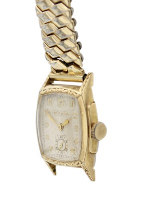 Lot 199 - A Bulova gold-plated manual wind gentleman's wristwatch and a travel clock.