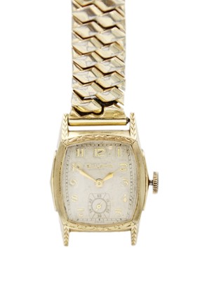 Lot 199 - A Bulova gold-plated manual wind gentleman's wristwatch and a travel clock.