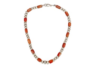 Lot 253 - A Christine Povey necklace with orange beads...