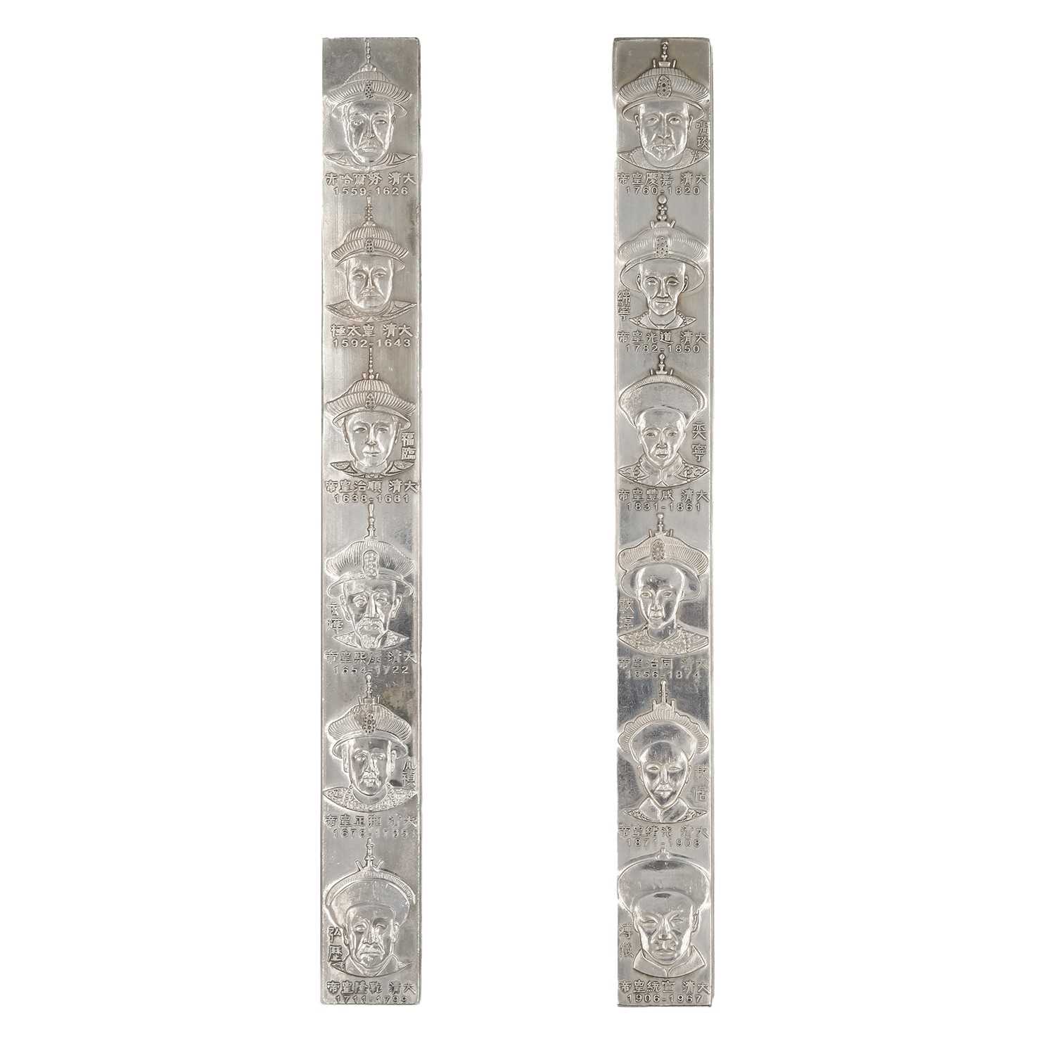 Lot 630 - A pair of Contemporary Chinese metal scroll weights.