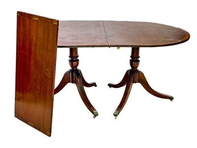 Lot 651 - A Regency style brass inlaid mahogany D-end dining table.