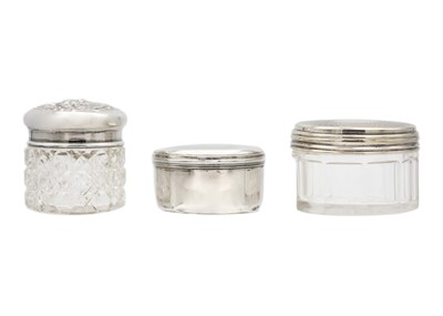 Lot 6 - A 19th-century Russian silver pill box, a silver-lidded glass jar, and one other with plated lid.