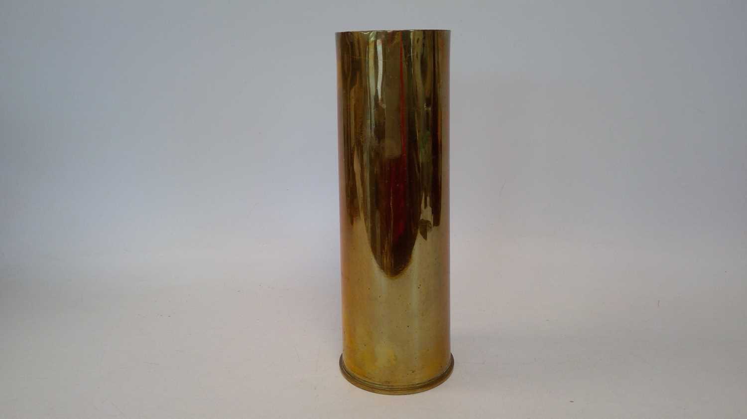 Lot 81 - A military brass 25-pounder shell casing from