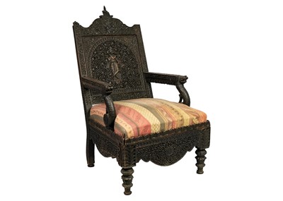 Lot 131 - A Burmese carved wood open armchair, 19th century.