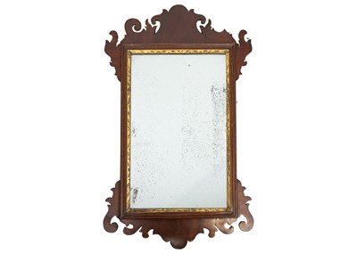 Lot 471 - A George III mahogany fretwork wall mirror.