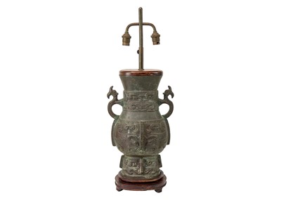 Lot 487 - A Chinese Archaic style bronze table lamp.