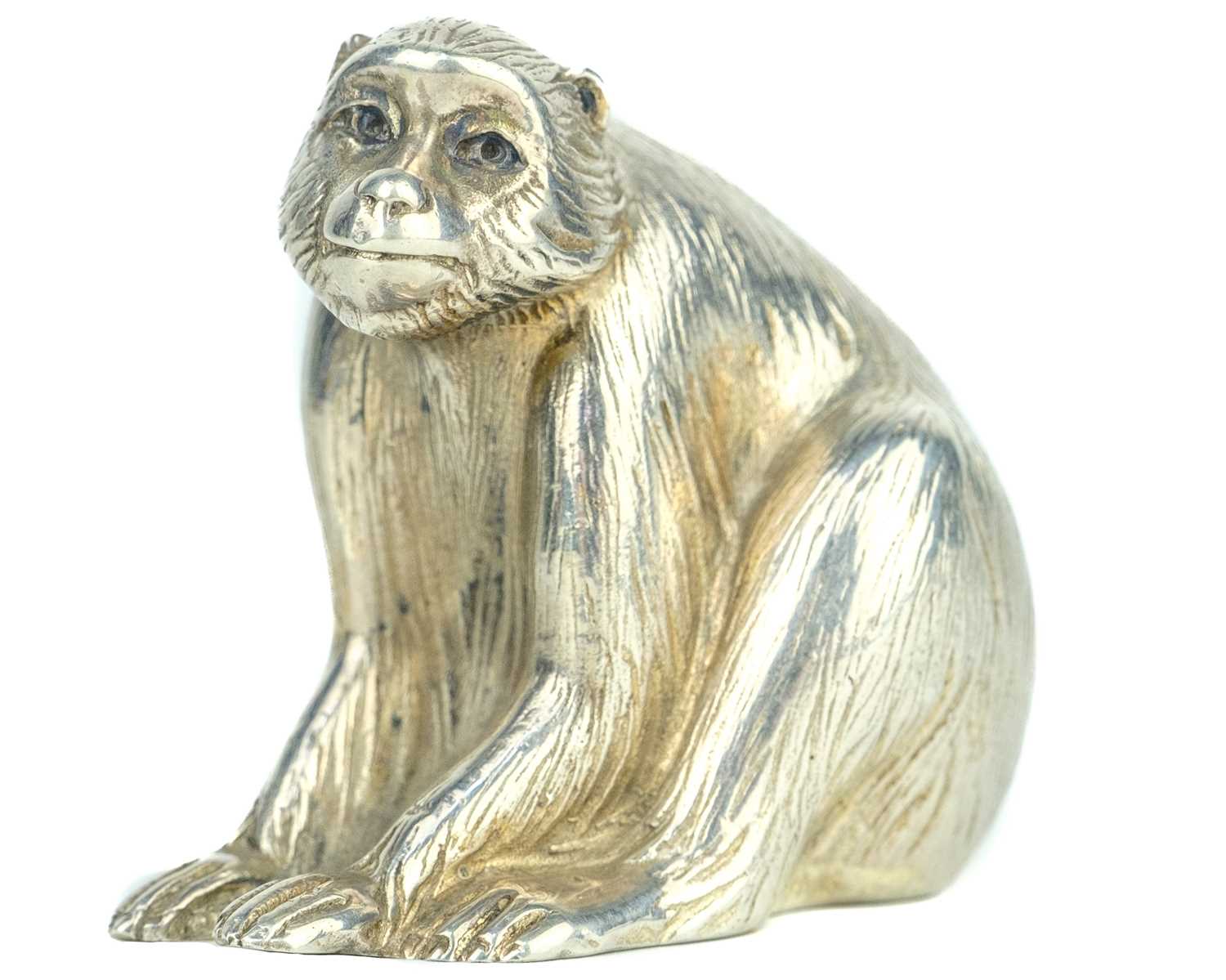 Lot 669 - A Japanese silver okimono of a macaque, signed.