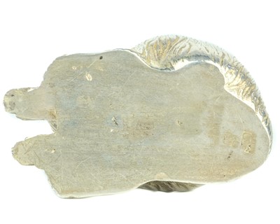 Lot 669 - A Japanese silver okimono of a macaque, signed.