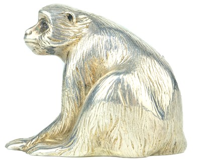 Lot 669 - A Japanese silver okimono of a macaque, signed.