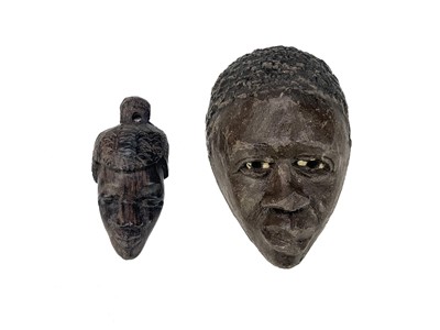 Lot 194 - An African carved wood carved mask.