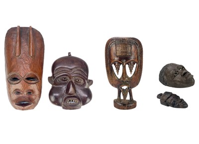 Lot 194 - An African carved wood carved mask.